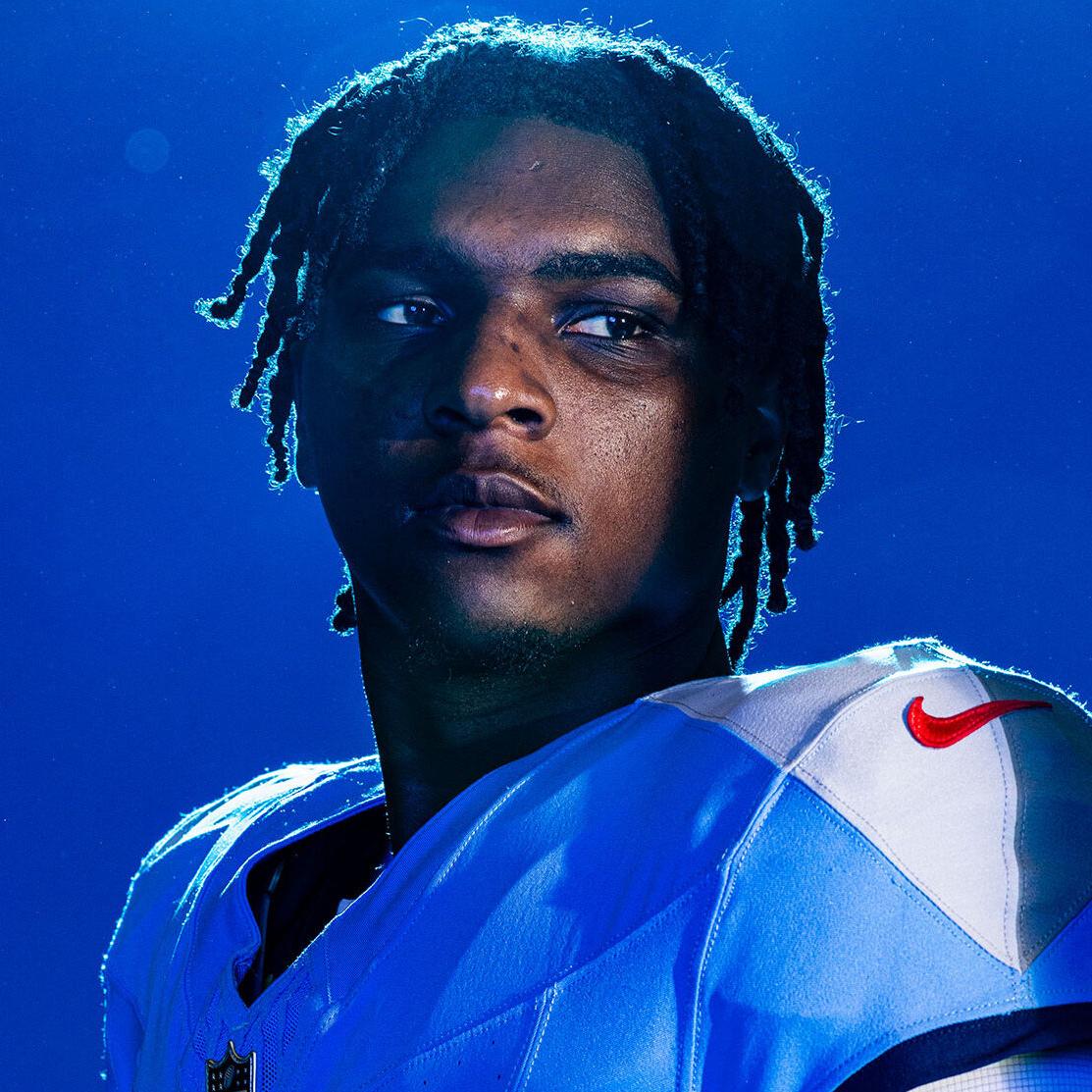 Cam Ward holding a football on the August, 28, 2025 Cover of the Nashville Scene